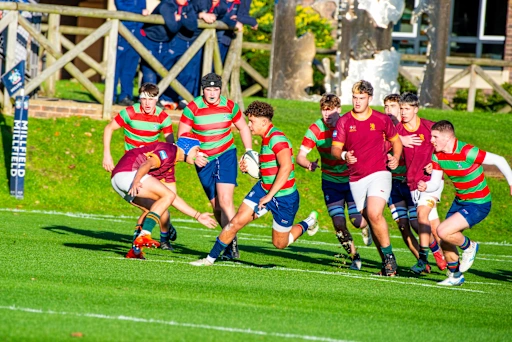 Millfield rugby players carrying the ball during a match